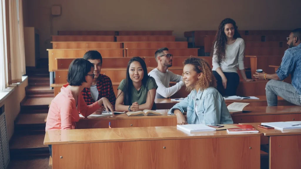 Students talking and studying in a lecture hall